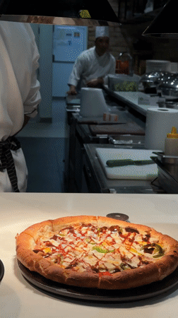 Dubai restaurant kitchen scene captured with chefs, prepared dishes