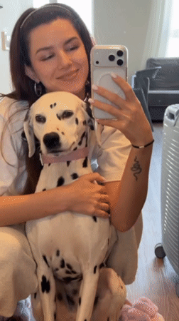 Woman documents morning routine with Dalmatian in Vladivostok selfies
