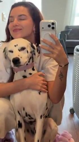 Woman documents morning routine with Dalmatian in Vladivostok selfies