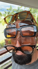 Stacking five pairs of sunglasses in Ko Samui