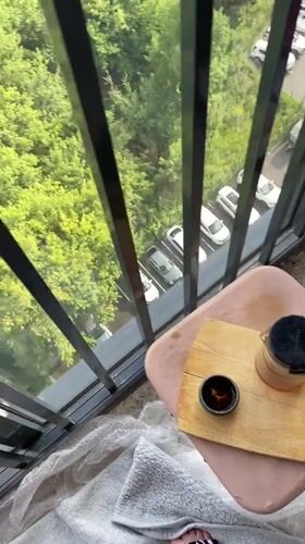 Balcony tea time overlooking Izhevsk on a July afternoon