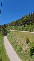 Tourist Takes Selfie on Austrian Ski Lift During Sunny Day