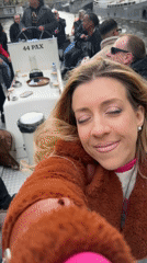 Canal boat passengers document Amsterdam waterway tour