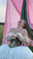 Outdoor fashion shoot in white gown among draped pink fabric, Foki