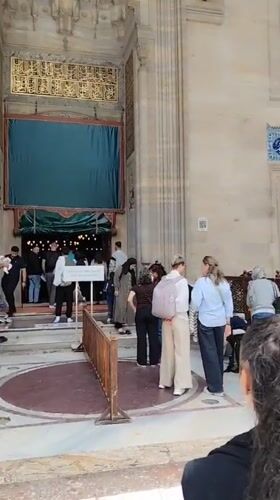 Tourist visits Süleymaniye Mosque complex in Istanbul during morning hours