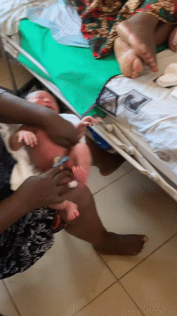 Newborn receives first care and bath in Jos, Nigeria