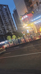Dusk street scene captured in Liangjiang, China
