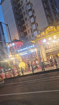 Dusk street scene captured in Liangjiang, China