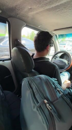 Travelers with luggage observed in car in Tashkent