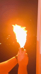 Person Creates Flame Display, Makes Gesture in Sofia