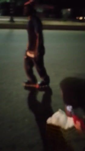 LED-lit roller skater glides through Nigeria night market streets