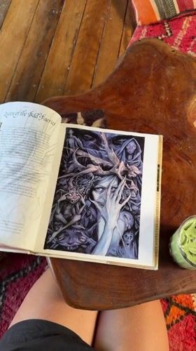 Person reads fairy book in tropical stilt house, General Luna