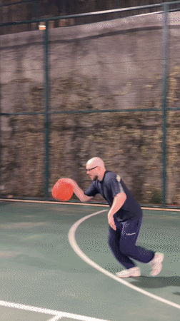 Man practices basketball on outdoor court in T'bilisi