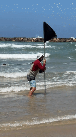 Flag demonstration and photography documented off Tel Aviv beach