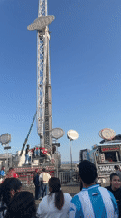 Amusement park ride 'Comber' operates in Barcelona under clear skies