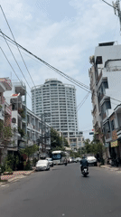 Street scene documented in Nha Trang featuring BAVICO building