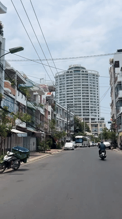 Street scene documented in Nha Trang featuring BAVICO building