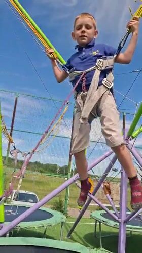 Child plays on trampoline equipment in Kokshetau, Kazakhstan