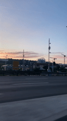 Dawn highway drive captured near Lyon with moonlit sky