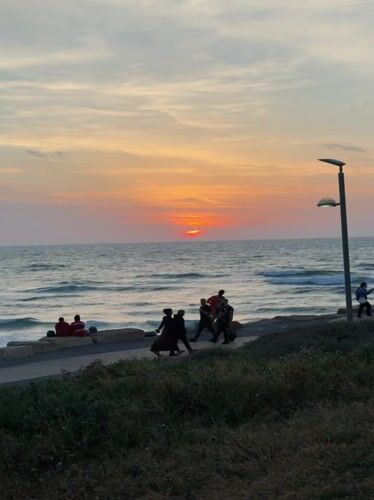 Sunset draws beachgoers to Tel Aviv's Mediterranean coastline