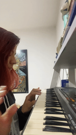 Person touching hair captured in Wilde, Argentina