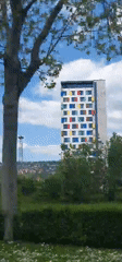 Modern residential building documented in Sarajevo under cloudy skies