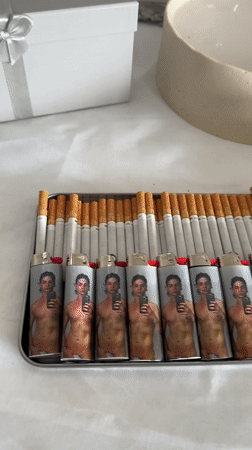 Table with cigarettes, fruits, and miscellaneous items filmed in Köln