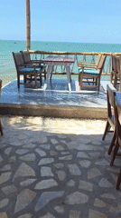 Beachside restaurant dining area captured in Vietnam coastal footage
