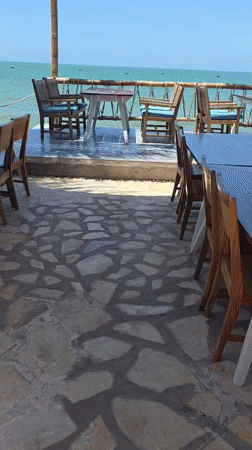 Beachside restaurant dining area captured in Vietnam coastal footage