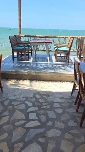 Beachside restaurant dining area captured in Vietnam coastal footage