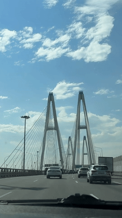 Traveler documents cable-stayed bridge crossing near Novosaratovka, Russia