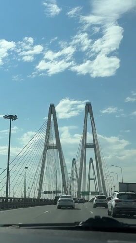 Traveler documents cable-stayed bridge crossing near Novosaratovka, Russia