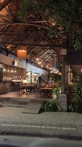Nighttime restaurant scene with live music captured in Ubud