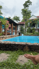Tropical resort pool in Bố Trạch, Vietnam, morning
