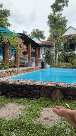 Tropical resort pool in Bố Trạch, Vietnam, morning