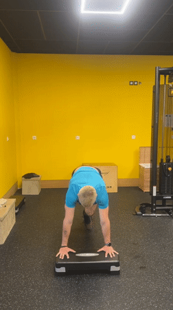 Man performs handstand exercises during gym workout in Bulgaria