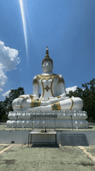 White Buddha statue with gold detailing observed in Thailand