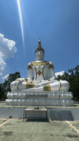 White Buddha statue with gold detailing observed in Thailand