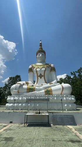 White Buddha statue with gold detailing observed in Thailand