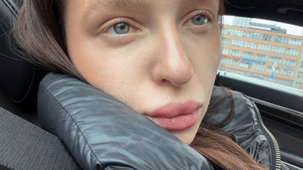Woman takes car selfies in Moscow