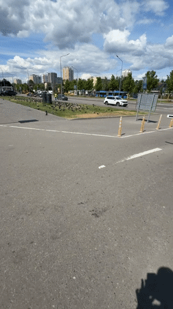 Pigeon flock gathers in Moscow urban area, worker paints nearby