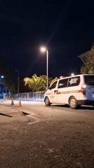 Late-night activity outside a Banda Aceh hospital emergency entrance