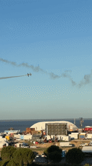 Aerobatics and crowds at an outdoor air show in Loures