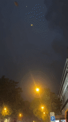 Rainy Paris night: bar football, wet streets, city glow