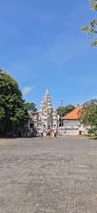 Morning visitors gather at ornate Balinese temple in Kuta Selatan
