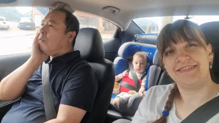 Family observed resting in car backseat in South Korea