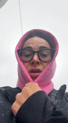 Person photographed during snowfall in Saint Petersburg