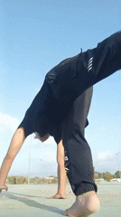 Man performs outdoor calisthenics routine in Juan Griego, Venezuela