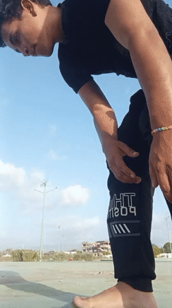 Man performs outdoor calisthenics routine in Juan Griego, Venezuela