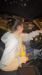 Woman drives at night in Moscow while vaping